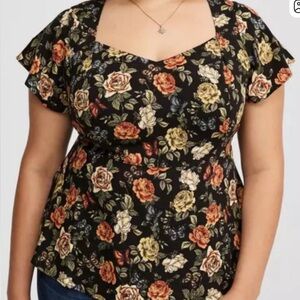 Torrid Black Peplum Top with Orange Floral Pattern